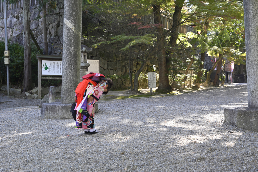 Bowing at Shrine Gate