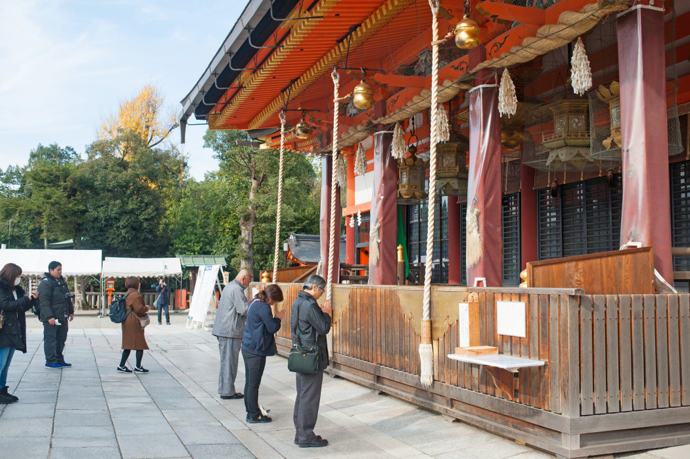 Praying at Yasaka Shrine