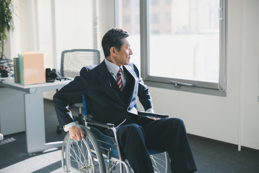 suited man in wheelchair