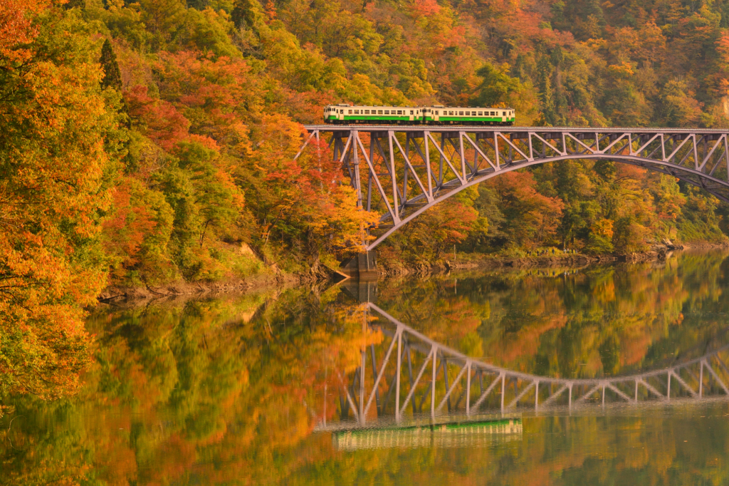 Tadami Line running on a railroad bridge